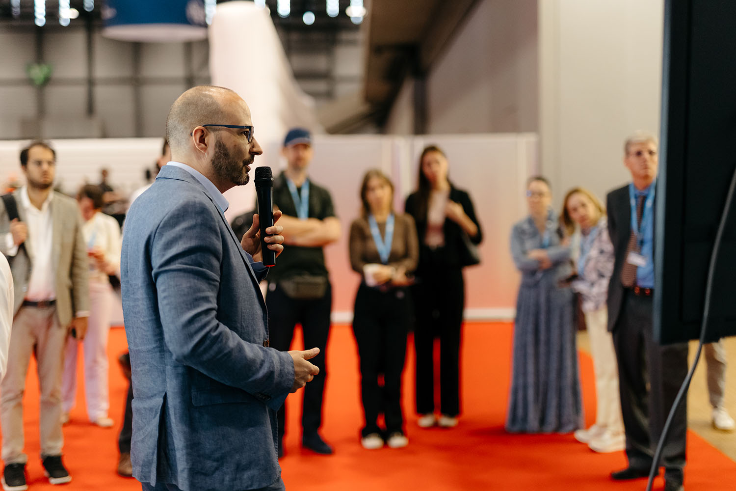 Diplo/GIP at AI for Good Global Summit 7 Crowd, Person, Adult, Female, Woman, Male, Man, Audience, Clothing, Coat, Speech, Formal Wear, Suit, Face, Head, FORG1VEN