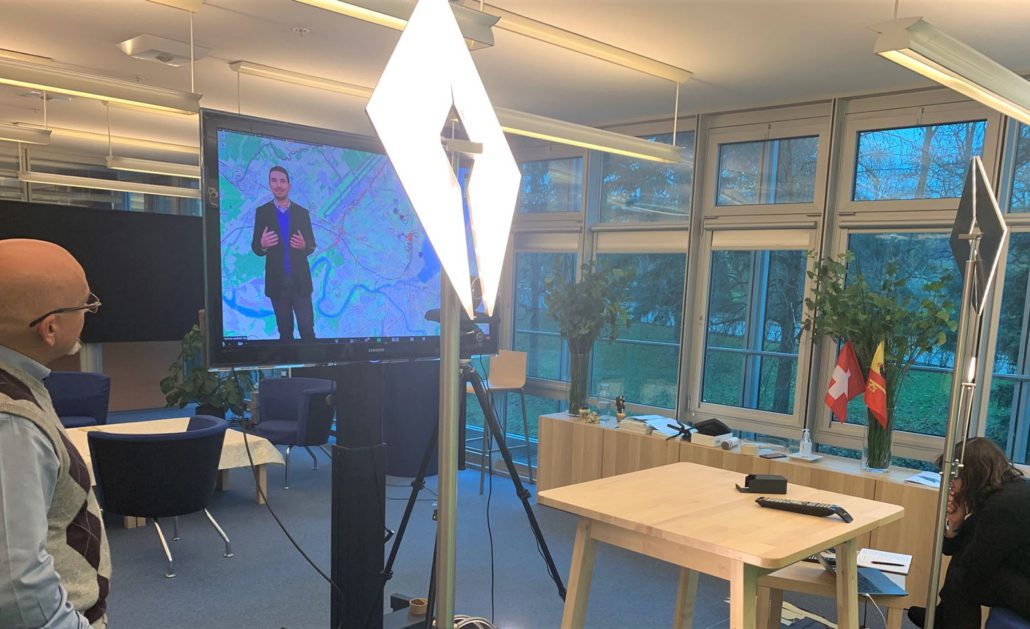 conftech-geneva-02 Furniture, Table, Desk, Crowd, Person, Adult, Male, Man, Female, Woman, Audience, Computer Hardware, Electronics, Hardware, Monitor, Screen, Speech, Chair, Head, Face, Architecture, Building