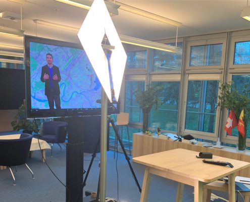 conftech-geneva-02 Furniture, Table, Desk, Crowd, Person, Adult, Male, Man, Female, Woman, Audience, Computer Hardware, Electronics, Hardware, Monitor, Screen, Speech, Chair, Head, Face, Architecture, Building