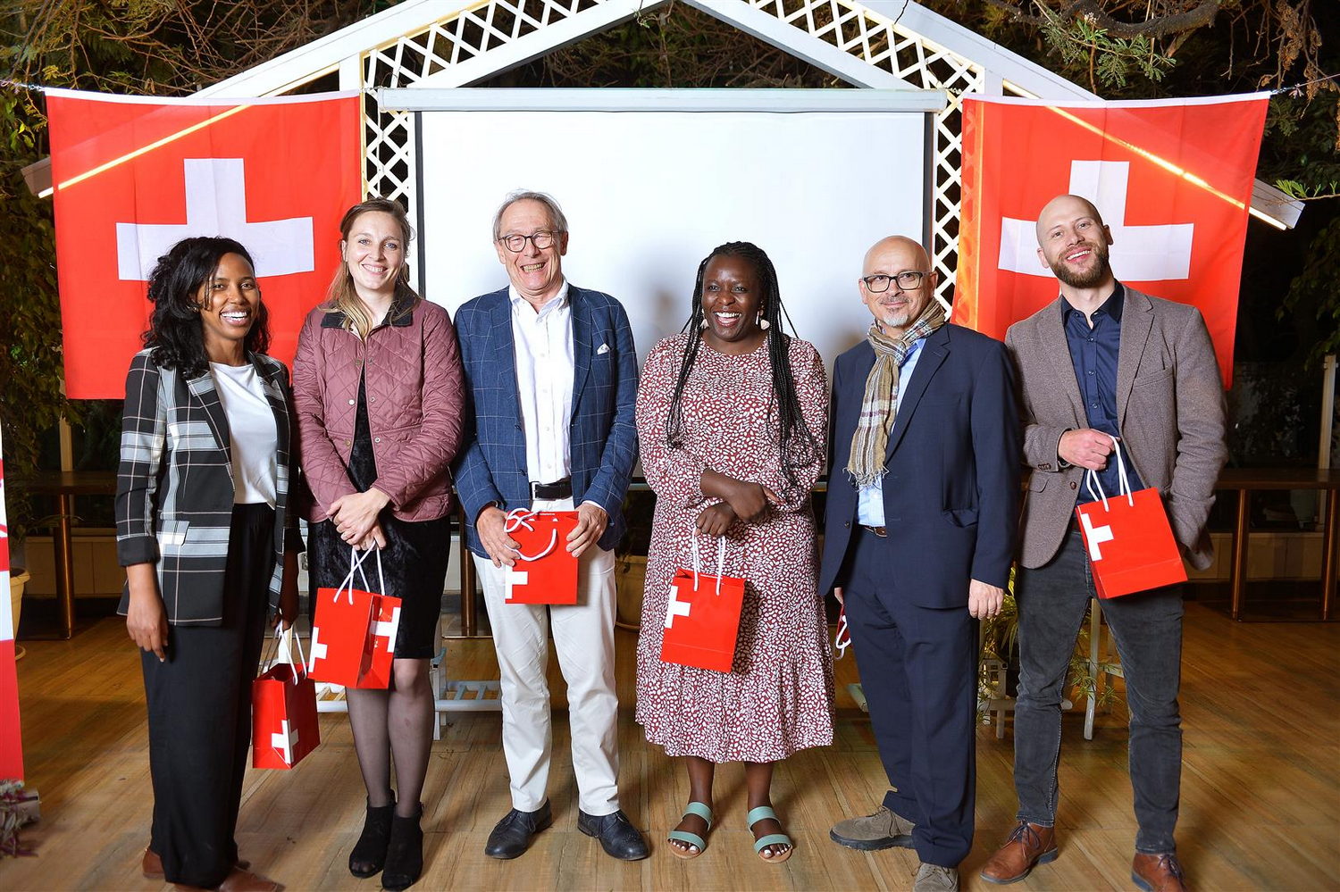  Groupshot, Person, Clothing, Coat, Adult, Female, Woman, Male, Man, Jeans, Pants, People, Accessories, Bag, Handbag, Footwear, Shoe, Face, Head