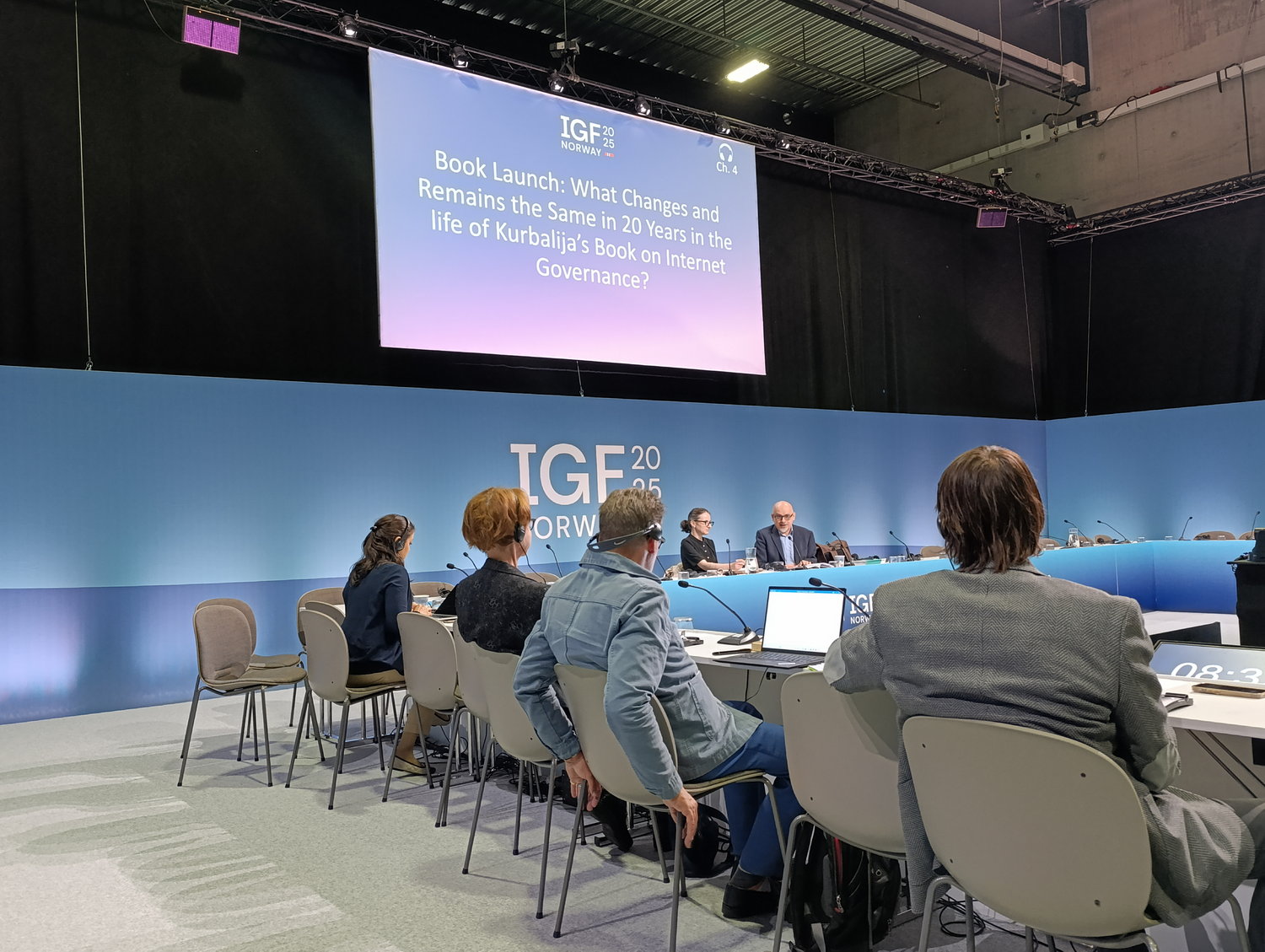 Diplo/GIP at IGF 2025 5 People, Person, Crowd, Adult, Male, Man, Audience, Architecture, Building, Classroom, Indoors, Room, School, Accessories, Bag, Handbag, Chair, Furniture, Lecture, Computer, Electronics, Laptop, Pc, Clothing, Footwear, Shoe, Speech, Hall, Juanma Bajo Ulloa, Lisa Badum