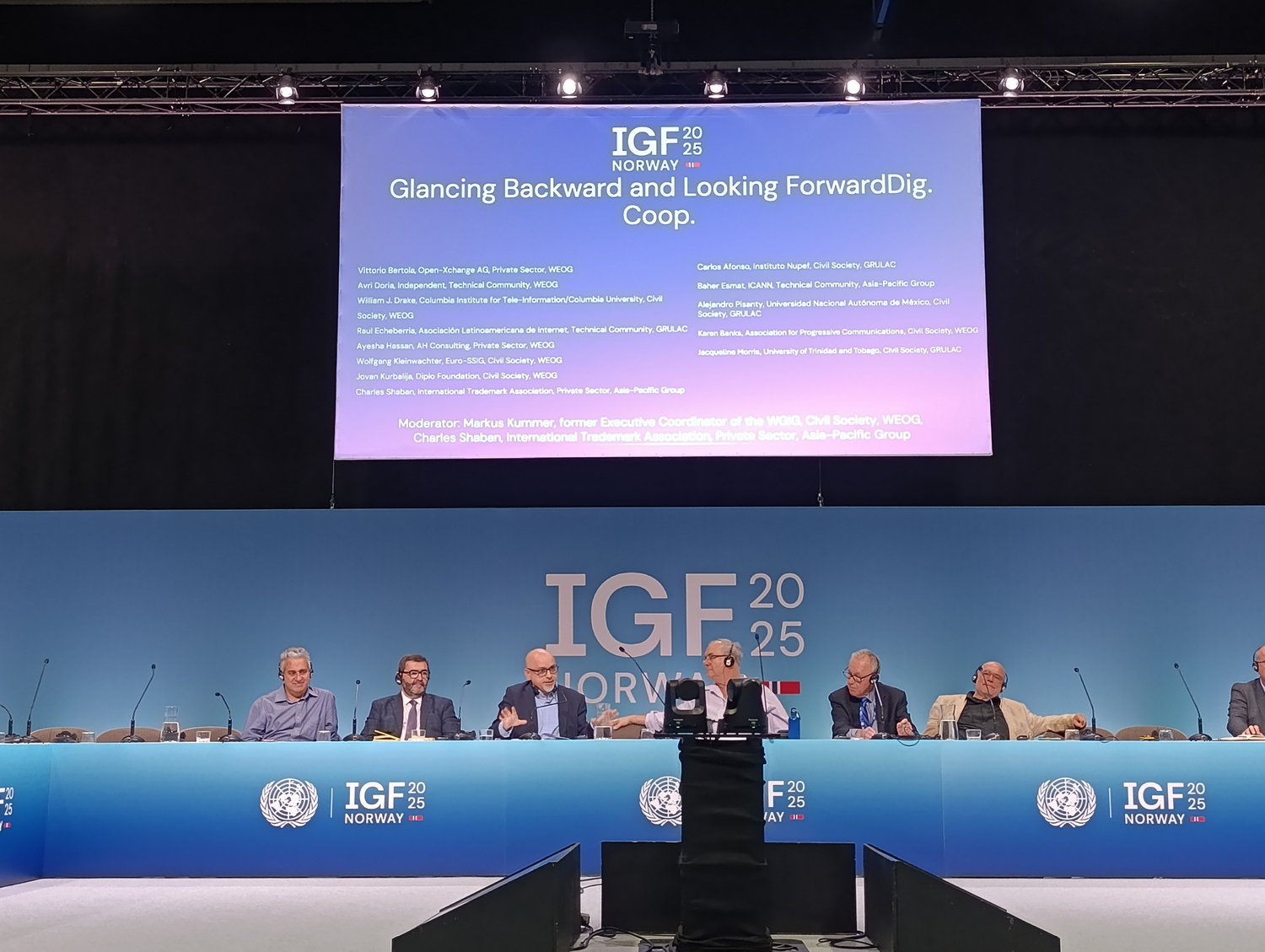 Diplo/GIP at IGF 2025 7 Crowd, Person, People, Audience, Speech, Accessories, Glasses, Electrical Device, Microphone, Computer Hardware, Electronics, Hardware, Monitor, Screen, Face, Head, Computer, Laptop, Pc, Lamp, Podium, Chair, Furniture, Michael Ben-Ari, Edward C. Prescott, Piero Marini, Günter Wallraff