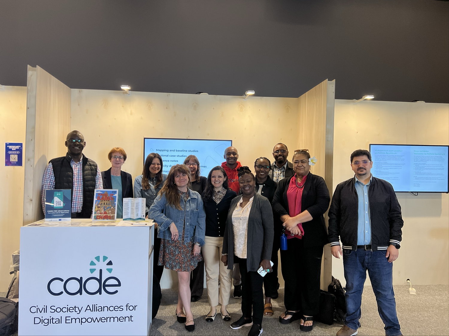 Diplo/GIP at IGF 2025 10 Groupshot, Person, Clothing, Footwear, Shoe, Adult, Female, Woman, Sandal, Coat, Male, Man, Accessories, Glasses, Bag, Handbag, Jewelry, Necklace, Jeans, Pants, Computer Hardware, Electronics, Hardware, Monitor, Screen, Lamp, People, Face, Head, Belt, Wristwatch, High Heel, Malaya Watson, Toni Blackman, LeRoi Moore, Diana Douglas, Dee Brown, Tamara Šoletić, Anne West