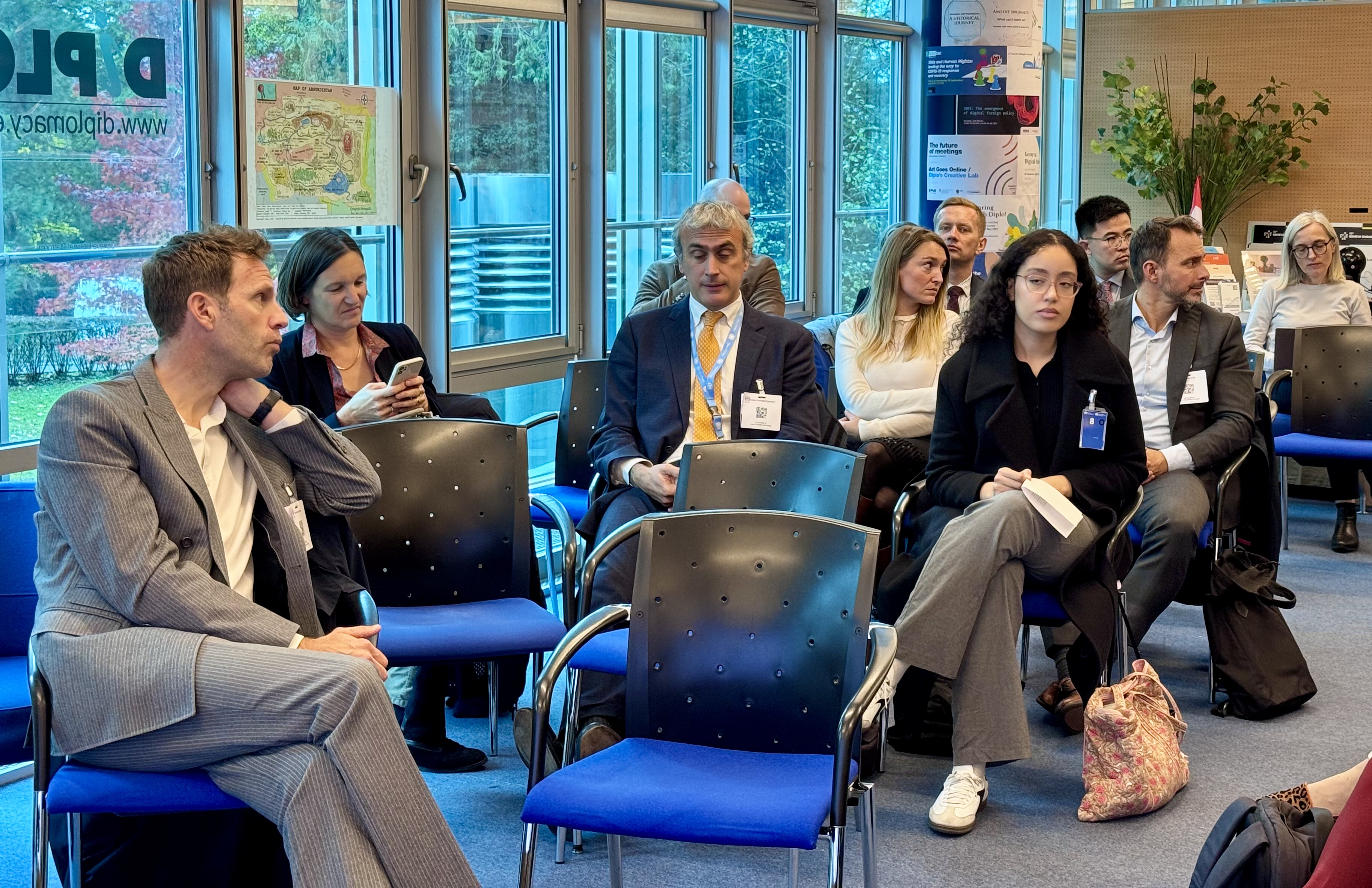  People, Person, Adult, Male, Man, Female, Woman, Clothing, Footwear, Shoe, Accessories, Glasses, Bag, Handbag, Formal Wear, Tie, Wristwatch, Jewelry, Necklace, Electronics, Mobile Phone, Phone, Chair, Furniture, Crowd, Face, Head, Computer Hardware, Hardware, Monitor, Screen, Indoors, Suit, Lucas Bernardi, Benito Floro, Rachel Whetstone, Clemens Meyer