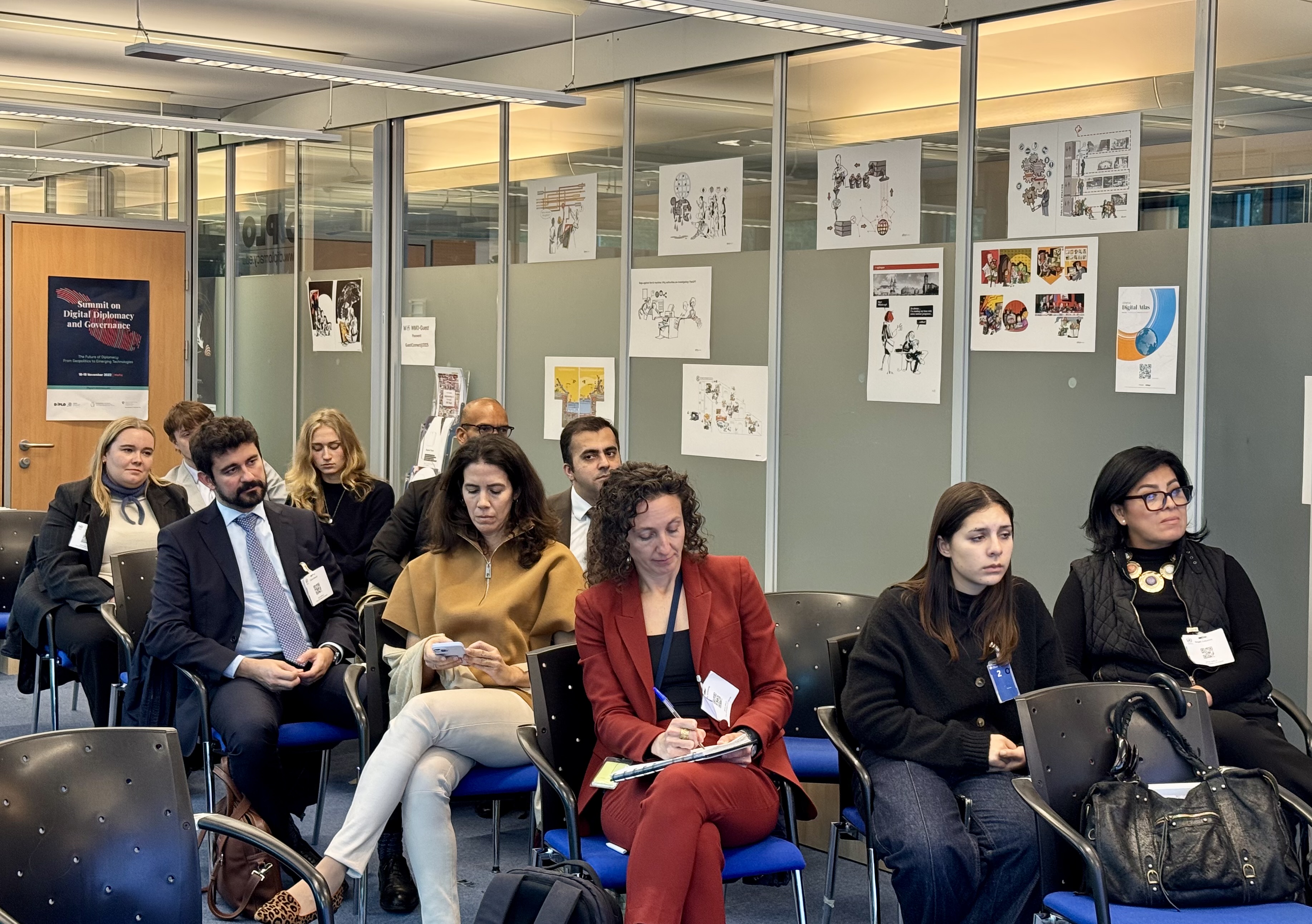  Adult, Female, Person, Woman, Accessories, Bag, Handbag, Glasses, Clothing, Footwear, Shoe, Male, Man, Formal Wear, Tie, Pen, People, Jewelry, Necklace, Indoors, Electronics, Mobile Phone, Phone, Chair, Furniture, Crowd, Lamp, Computer, Laptop, Pc, Groupshot, Laura Räty