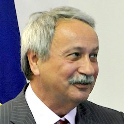 The DiploAI Ecosystem 28 Face, Head, Person, Photography, Portrait, Adult, Male, Man, People, Accessories, Formal Wear, Tie, Indoors, Clothing, Suit